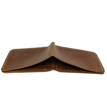 The copper wallet face down showing the billfold section on the back.