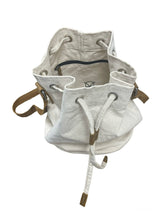 White Canvas Handbag showcasing HYDE buffalo head logo on big inside pocket with leather zipper tab.