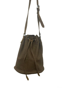 Brown Leather and Canvas bag showing metal hardware connecting the bag to the sturdy strap.